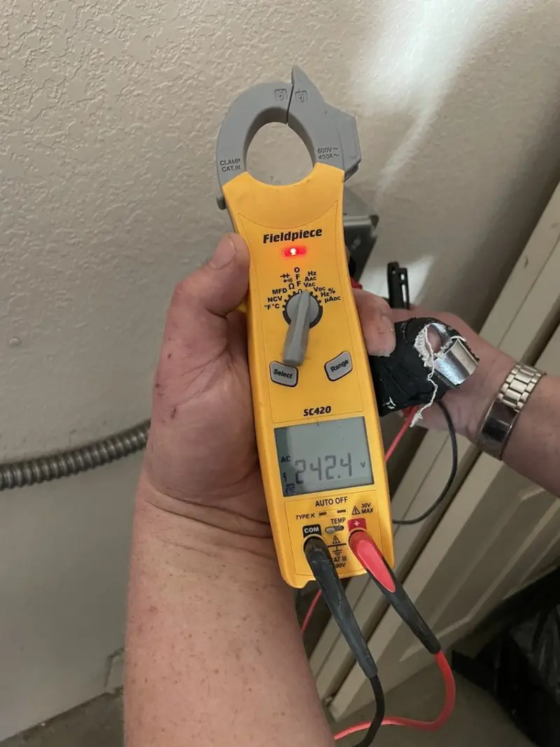 Voltage testing with clamp meter during Outlet Installation in Helena-West Helena